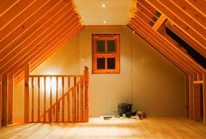 A newly-finished attic with tools still on the floor.