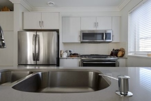 A kitchen with stainless steel appliances.