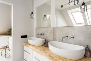Modern bathroom with white vessel sinks