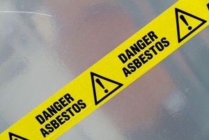 A sign that says "danger asbestos."