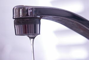 A kitchen faucet suffering from low water pressure.