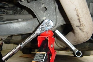 A closeup image of a car's control arm.