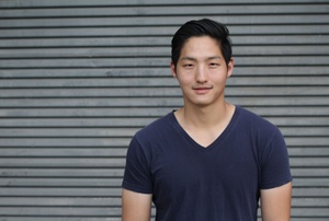 A man in a black v neck shirt