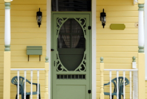 A decorative storm door outside the front of a home.