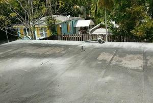 A flat roof with bald spots.