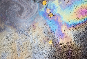 rainbow spilled motor oil on asphalt