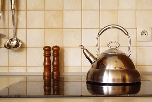 metal tea kettle in kitchen