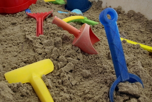 plastic children's toys in sand