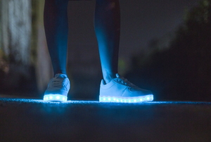 led shoes on legs in the dark