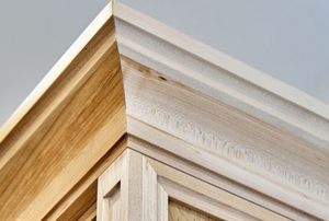 wood crown molding on a ceiling and wall