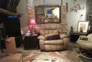 A man cave decorated with stone and granite.