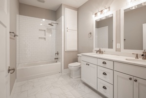 A bathroom with lighted mirrors.