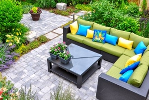 outdoor patio area with plants and furniture