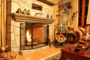 A fireplace fire in a rustic room.