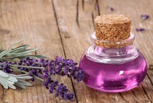 bottle of lavender oil and lavender herb
