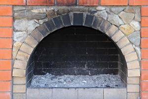 A sooty fireplace hearth.