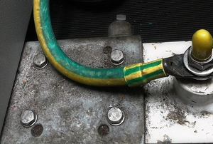 A ground wire connected to a metal plate