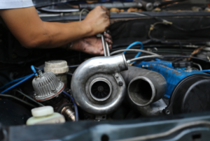 Man working on a car engine