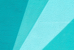 bright blue and green angular shapes painted on a wall