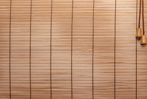 A window with bamboo blinds.