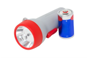 flashlight with battery next to it
