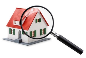 Magnifying glass and house.
