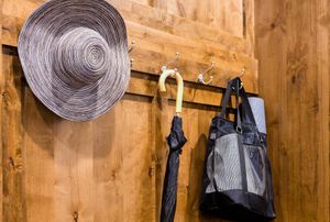 hat, umbrella, and bag hanging on hooks