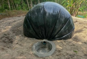 a curved, plastic biodigester