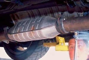 A catalytic converter still attached beneath the car.