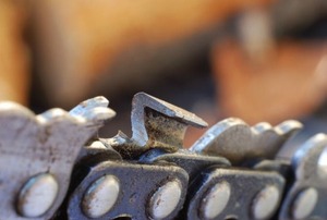 A closeup of a chainsaw chain.