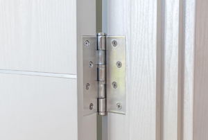 white interior door with silver hinge