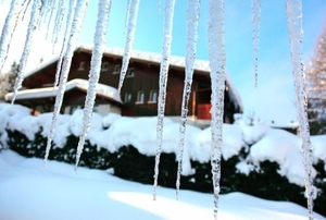 Icicles hang from the eaves on a cold winter morning.