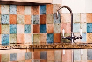 multi-colored tile backsplash in a kitchen