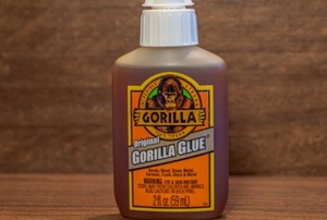 bottle of Gorilla Glue in front of wood surface