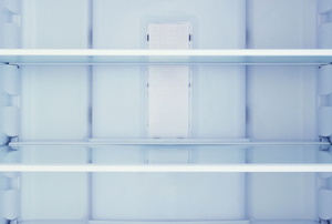 empty refrigerator with clean shelves