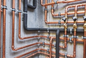 various copper and insulated pipes on walls