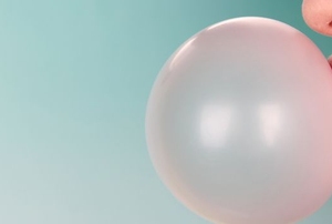 Someone blows a bubble with gum.
