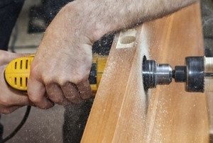 circle saw cutting a hole in a door for a lock