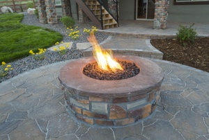 flames rising from a patio fire pit