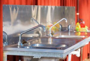 A stainless steel sink in a patio.