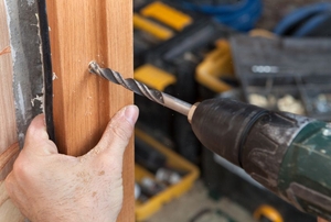 A man installing a door jamb.