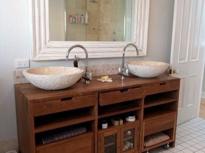 dark wood vanity with double sinks