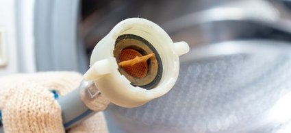 How to Repair a Leaking Washing Machine Drain Hose | DoItYourself.com