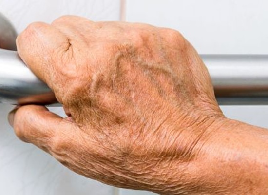 hand holding support grab bar