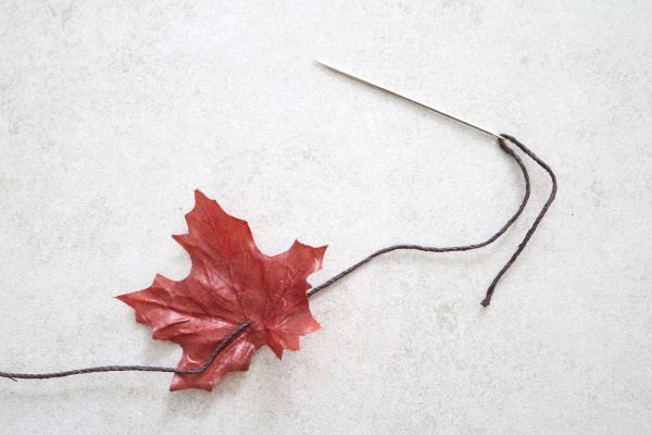 Threading the leaf onto the cord.