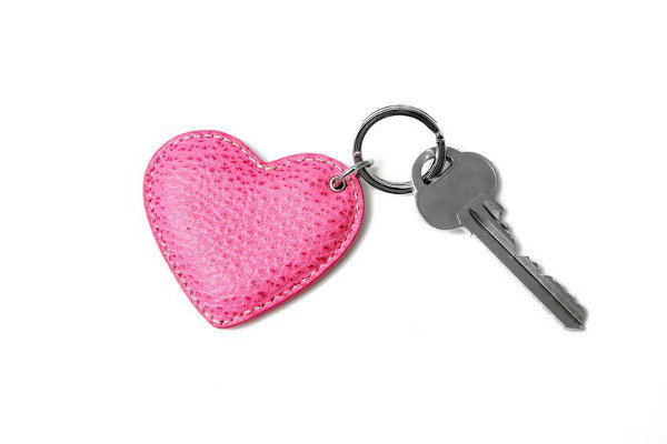 A heart key chain and a key. 