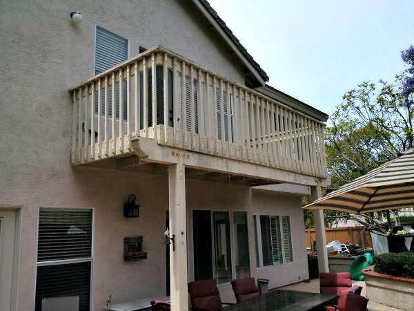 home with second story balcony