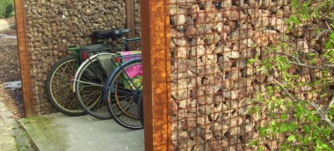 Bike storage area surrounded by rock-filled wire walls