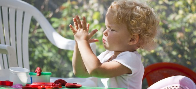 A child plays with Playdough.