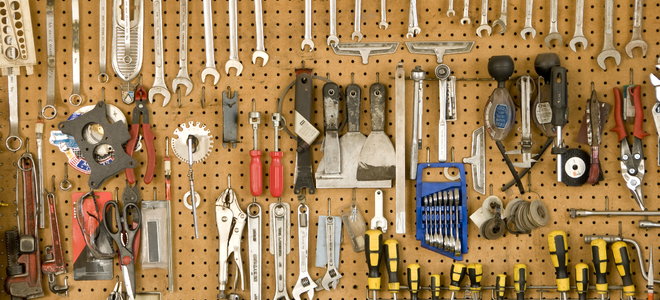 A pegboard holding tools.